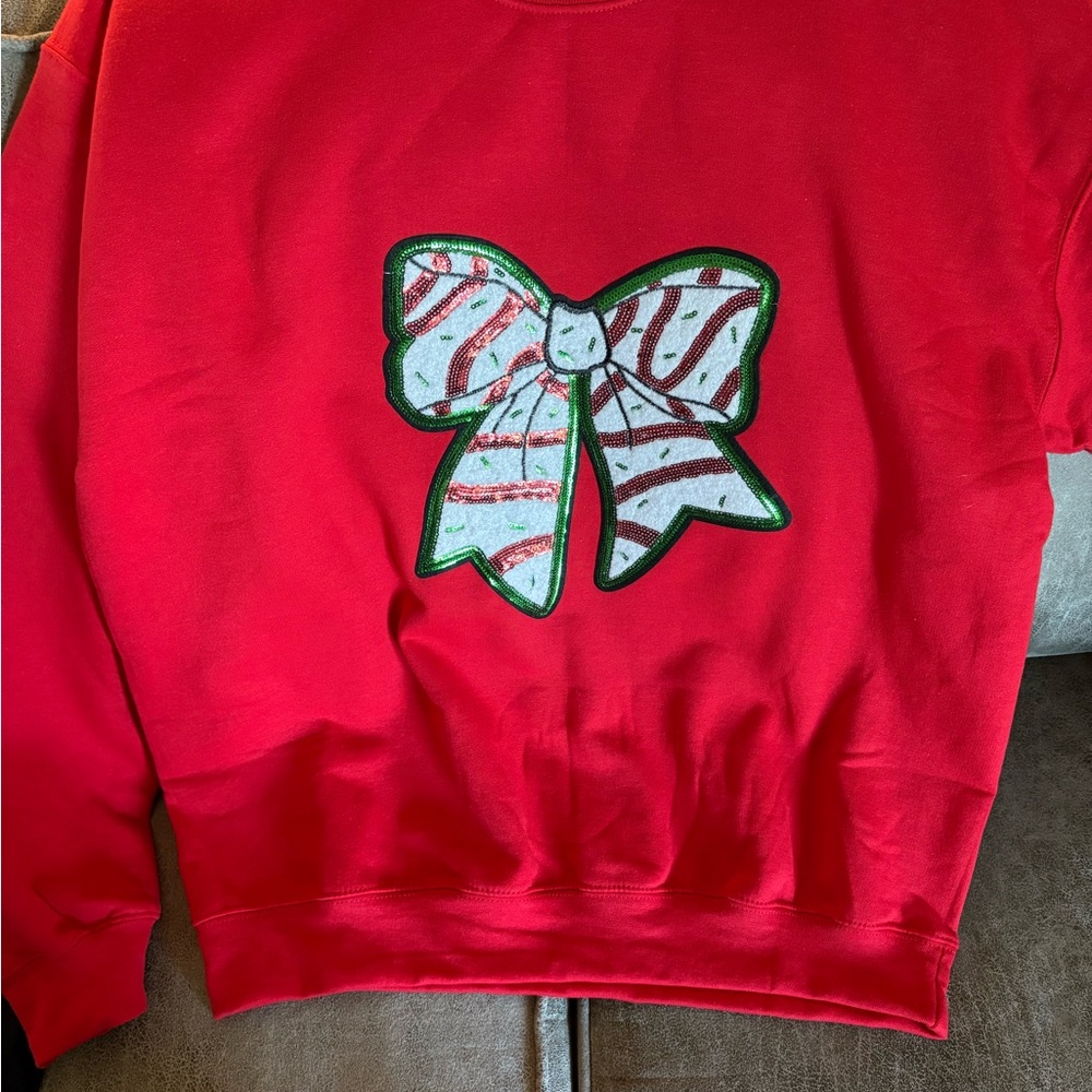 Red Sweatshirt with Festive Bow Design